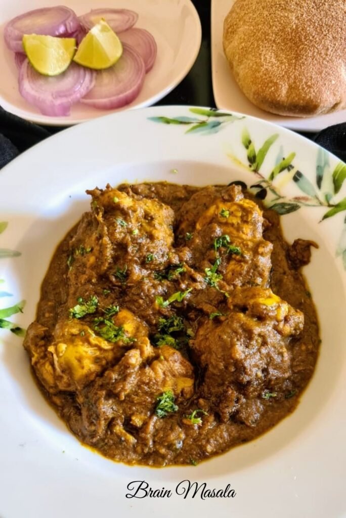 A bowl of richly spiced brain masala in a metal dish, with tender brain pieces immersed in thick reddish-brown gravy, garnished with fresh coriander—served alongside chopped onions and lemon wedges. Image 2 (turn0image2): Close-up of a stainless-steel handi filled with creamy brain masala; soft brain chunks are coated in masala, with a slight sheen of oil highlighting the vibrant orange-brown sauce. Image 3 (turn0image7): Crispy-fried brain masala on a white plate, sprinkled with green cilantro; small brain bites have browned edges and visible spice flakes. Image 4 (turn0image11): A rustic bowl of bheja fry masala—finely broken brain bits sautéed with aromatic spices and topped with fresh cilantro—on a white surface with rustic aesthetic. These should match the typical look of a spicy brain masala dish as implied by the article you mentioned. If you'd like a full recipe or region-specific variation (like Peshawari maghaz masala), just let me know! 😊 Sources