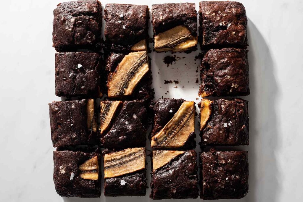 “Stacked banana bread brownie bars showing moist texture and banana pieces.”