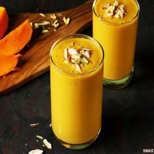 "Close-up of fresh mango cubes in a bowl, ready to be added to the blender."