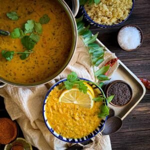 with whole lentils beside raw ingredients and a ladle — demonstrating the cooking presentation in an Instant Pot setup.
