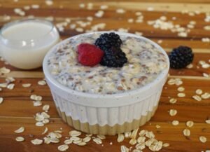 Creamy raspberry chia pudding made with coconut milk, garnished with fresh berries